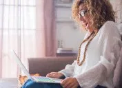 woman reading a computer